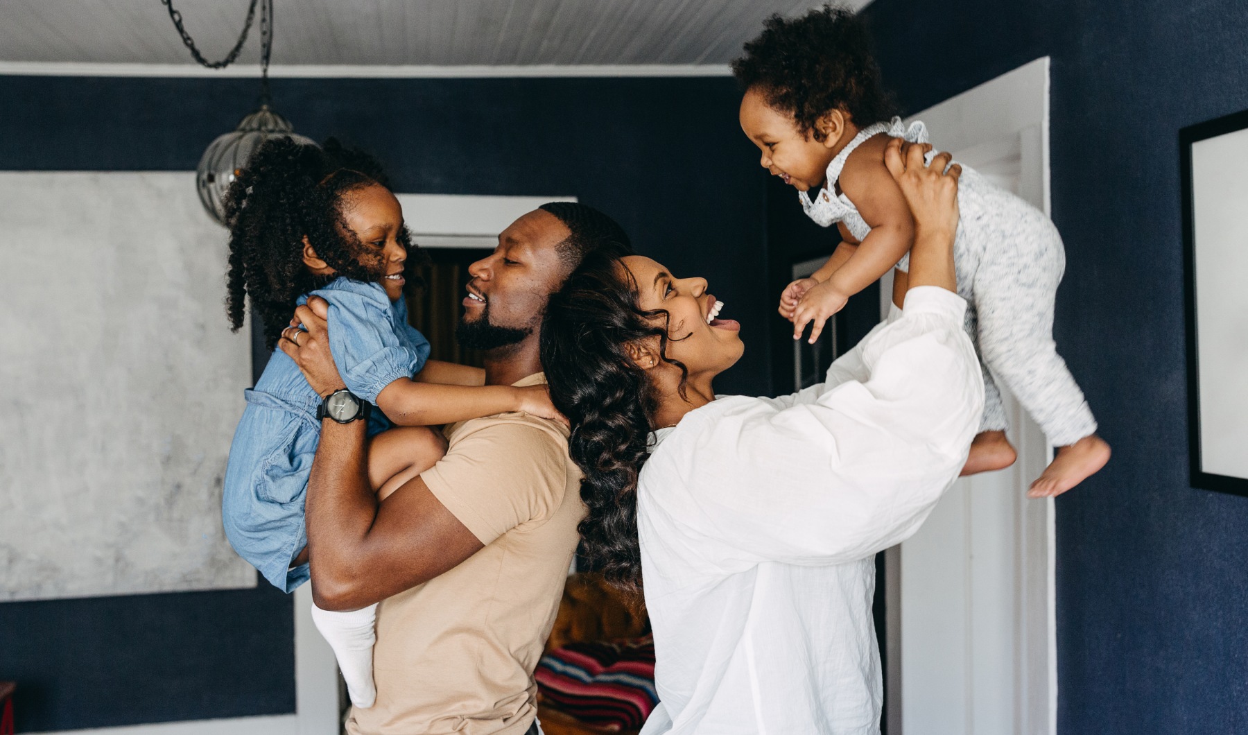 Find Your Home A mother and father with their children